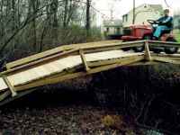 Tractor on Wooden Rainbow Bridge